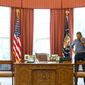 President Obama confers by phone from the Oval Office with his Russian counterpart, Vladimir Putin, about the situation in Ukraine recently. Ukraine&#39;s prime minister is due Wednesday in Washington. (White House)
