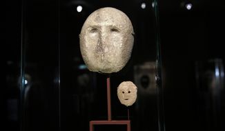In this  Monday, March 10, 2014 photo, 9,000 year-old masks are on display at the Israel Museum in Jerusalem. The exhibition called &amp;quot;Face To Face&amp;quot; shows eleven stone masks, said to have been discovered in the Judean desert and hills near Jerusalem, which date back 9,000 years and offer a rare glimpse at some of civilization’s first communal rituals. (AP Photo/Tsafrir Abayov)
