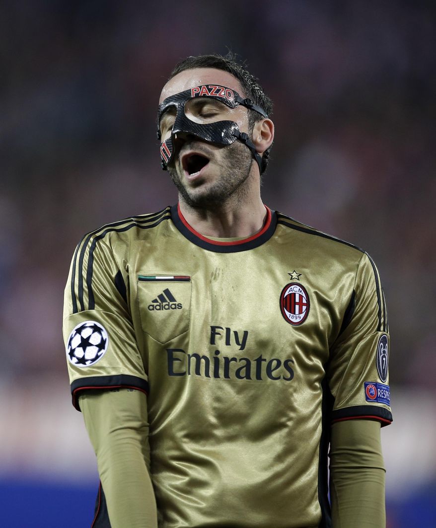 AC Milan's Giampaolo Pazzini reacts during a Champions League, round of 16, second leg, soccer match between Atletico Madrid and AC Milan at the Vicente Calderon stadium in Madrid, Tuesday March 11, 2014. AC Milan lost 1-4. (AP Photo/Paul White)