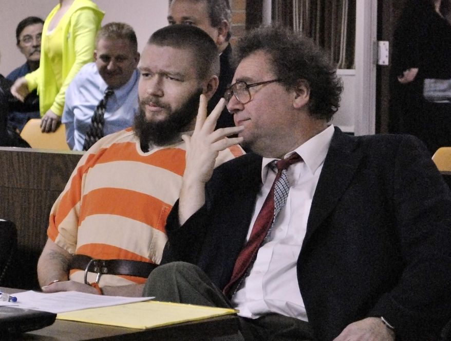 Kyle Flack, left, of Ottawa, Kan., sits with his court-appointed lawyer, Ronald Evans, head of the Kansas Death Penalty Defense Unit in Topeka, during a hearing in Franklin County District Court Tuesday, March 11, 2014, in Ottawa, Kan. Flack, 28, is charged with capital murder and other charges in the slaying of four people, including an 18-month-old girl, at a farm in rural eastern Kansas last spring. (AP Photo/The Ottawa Herald, Abby Eckel, Pool)