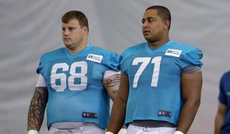 FILE - In this July 24, 2013, file photol, Miami Dolphins guard Richie Incognito (68) and tackle Jonathan Martin (71) stand on the field during NFL football practice in Davie, Fla. Martin, the offensive tackle at the center of the Dolphins&#39; bullying scandal, has been traded to the San Francisco 49ers. The Dolphins announced the deal Tuesday night, March 11, 2014, on the first day of NFL free agency. Martin&#39;s move cross country brings him back to the Bay Area to be reunited with his former Stanford coach, Jim Harbaugh. (AP Photo/Lynne Sladky, File)