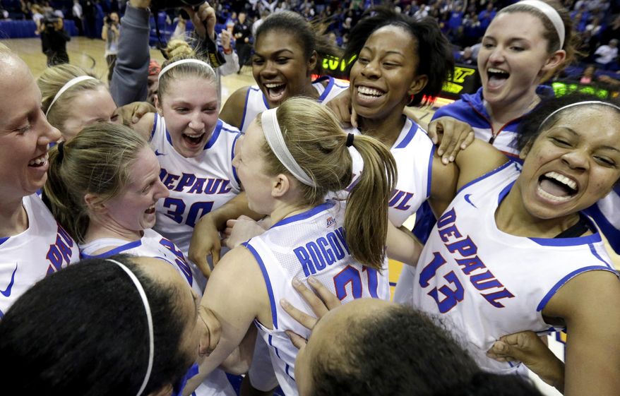 DePaul players celebrate after they defeated St. John's 65-57 during an NCAA college basketball game in the final of the 2014 Big East women's basketball tournament in Rosemont, Ill., Tuesday, March 11, 2014. (AP Photo/Nam Y. Huh)