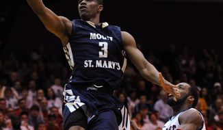 Mount St. Mary&#x27;s&#x27; Sam Prescott (3) drives for a lay up against Robert Morris&#x27; Lucky Jones during the first half of the Northeastern Conference championship NCAA college basketball game on Tuesday, March 11, 2014, in Coraopolis, Pa. (AP Photo/Don Wright)
