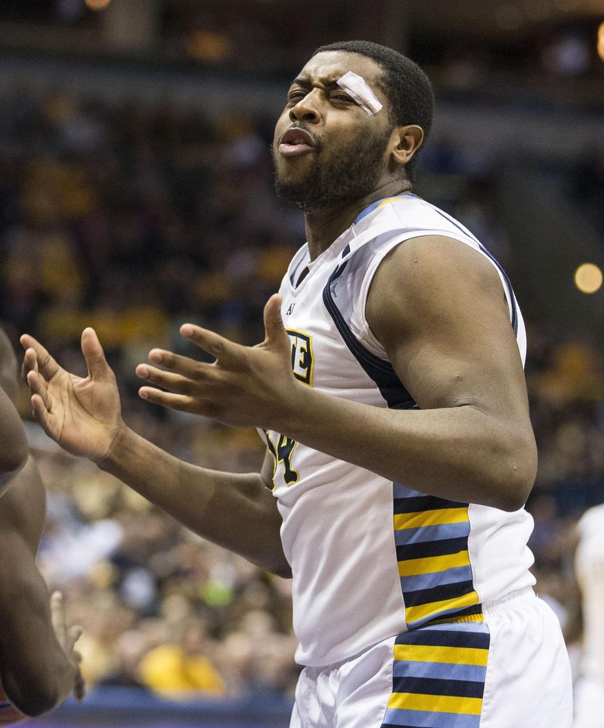Marquette's Davante Gardner looks for a foul call on the St. John's defense during the first half of an NCAA college basketball game Saturday, March 8, 2014, in Milwaukee. (AP Photo/Tom Lynn)