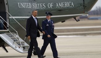 President Barack Obama is escorted by Col. William M. Knight,  Commander of the 11th Wing, upon his arrival aboard the Marine One helicopter at Andrews Air Force Base in Md., Tuesday March. 11,  2014,. Obama is traveling to New York for a pair of fundraisers for the Democrats. ( AP Photo/Jose Luis Magana)