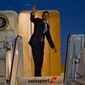U.S. President Barack Obama waves as he boards Air Force One at John F. Kennedy International Airport in New York, Tuesday, March 11, 2014, after attending a pair of Democratic fundraisers. (AP Photo/Craig Ruttle)