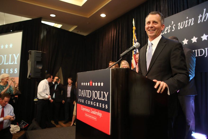 Republican David W. Jolly won Tuesday in a Florida congressional race in an election emblematic of the new reality of money in politics. (Associated Press)