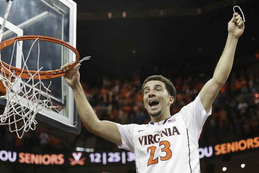 Virginia guard London Perrantes (23) celebrates his teams win over Syracuse after an NCAA College basketball game in Charlottesville, Va., Saturday, March 1, 2014. Virginia won the game 75-56. (AP Photo/Steve Helber)