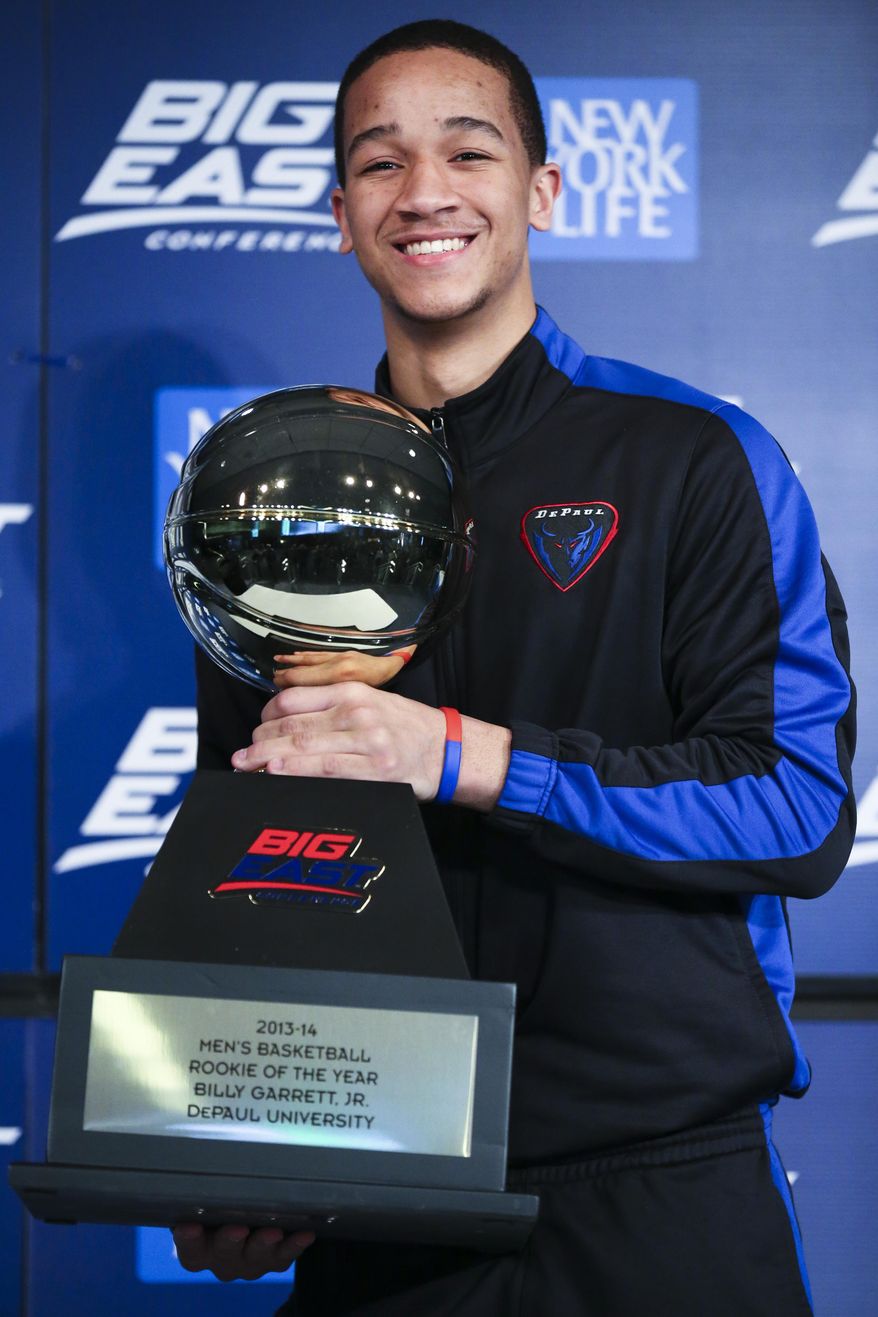 DePaul's Billy Garrett Jr. holds his Big East Conference Rookie of the Year trophy during a media availability before the Big East NCAA college basketball tournament on Wednesday, March 12, 2014, in New York. (AP Photo/John Minchillo)