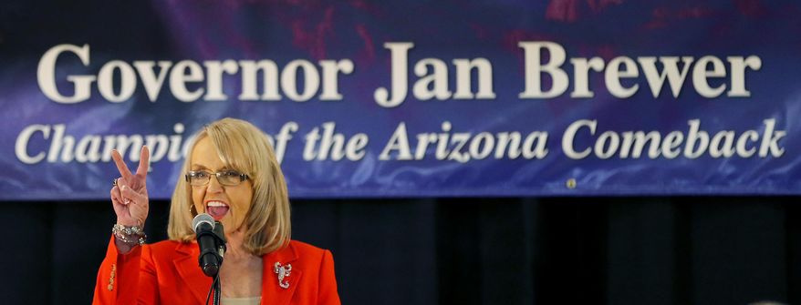 Arizona Gov. Jan Brewer announces that she will not seek a third term and will retire at the end of her current term, Wednesday, March 12, 2014, in Glendale, Ariz. The Arizona Constitution limits governors to two terms, but Brewer and her advisers have kept alive a scenario in which she might mount a longshot legal challenge to seek another four years in office. (AP Photo/Matt York)