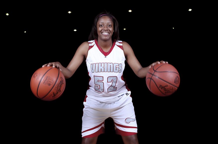 In this Oct. 29, 2013, photo, Princeton's Kelsey Mitchell poses during basketball practice in Sharonville, Ohio. Mitchell is a unanimous choice as 2014 Associated Press Ohio Ms. Basketball, the 27th recipient of the award emblematic of the best girls player in the state. (AP Photo/The Enquirer, Joseph Fuqua II) NO SALES