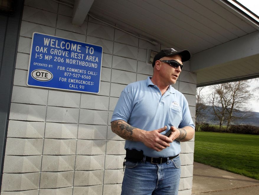 Shane Hayes with Oregon Travel Experience has been working at the Oak Grove Rest Area north of Eugene, Ore. since the company took it over a few weeks ago as part of a gradual hand off of rest stops to the semi-independent state agency overseen by the Oregon Travel Information Council. (AP Photo/The Register-Guard, Chris Pietsch)