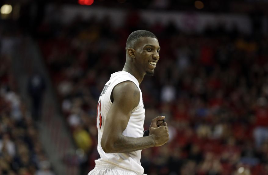 San Diego State's Winston Shepard reacts after score during the first half of an NCAA college basketball game against Utah State in the quarterfinals of the Mountain West Conference tournament Thursday, March 13, 2014, in Las Vegas. (AP Photo/Isaac Brekken)