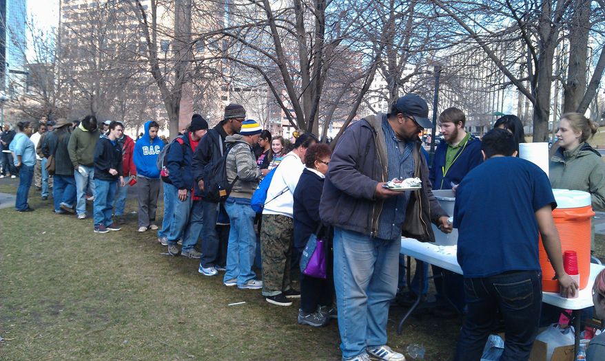 More than 300 homeless people lined on a recent weekend in Denver up for a free meal provided by Christ in the City.