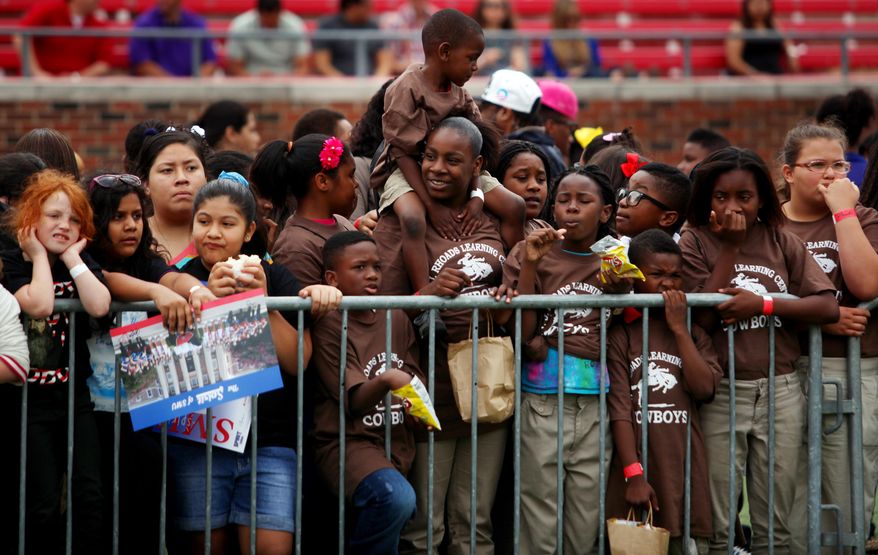 ADVANCE FOR RELEASE MONDAY, MARCH 17, 2014, AND THEREAFTER - In this Saturday, April 27, 2013 photo, the Imagine 2020 initiative, which focuses on inspiring students despite obstacles through engagement, education, and various resources, kicks off with a celebration event at SMU's Ford Stadium, in Dallas. The multi-million dollar initiative that targets struggling Dallas Independent School District campuses has taken off, and some principals say it's paying off. (AP Photo/The Dallas Morning News, Mona Reeder) MANDATORY CREDIT; MAGS OUT; TV OUT; INTERNET USE BY AP MEMBERS ONLY; NO SALES