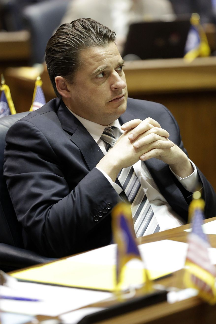 House Minority Leader Scott Pelath, D-Michigan City, listens to debate on the final day of the 2014 legislative session at the Statehouse in Indianapolis, Thursday, March 13, 2014. (AP Photo/AJ Mast)