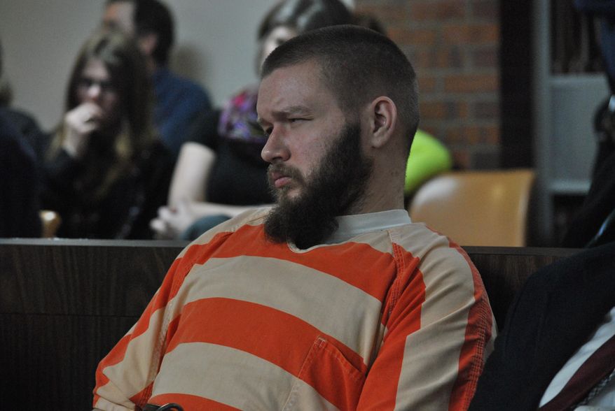 Kyle Flack, 28, of Ottawa, who is charged in connection with the killing of three adults and an 18-month-old girl in 2013, listens to testimony, Tuesday, March 11, 2014, in Ottawa, Kan. Flack, 28, is charged with capital murder and other charges in the slaying of four people at a farm in rural eastern Kansas last spring. (AP Photo/The Ottawa Herald, Abby Eckel, Pool)