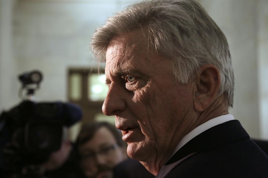 Arkansas Gov. Mike Beebe answers reporters questions in a hallway at the Arkansas state Capitol in Little Rock, Ark., Wednesday, March 12, 2014. The 2014 fiscal legislative session recessed Wednesday. (AP Photo/Danny Johnston)