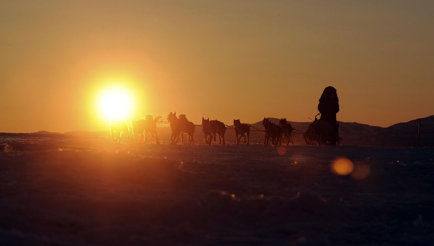 10ThingstoSeeSports - Iditarod musher John Baker, of Kotzebue, Alaska, comes into the Unalakleet checkpoint at sunrise during the Iditarod Trail Sled Dog Race on Sunday, March 9, 2014, in Unalakleet, Alaska. (AP Photo/The Anchorage Daily News, Bob Hallinen, File)