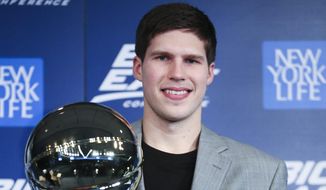 Creighton&#39;s Doug McDermott holds his Big East Conference Player of the Year trophy during a media availability before the Big East NCAA college basketball tournament on Wednesday, March 12, 2014, in New York. (AP Photo/John Minchillo)