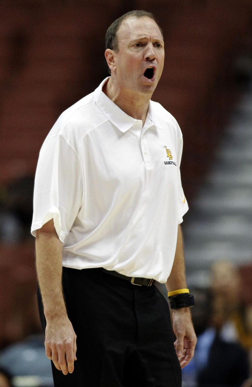 Long Beach State head coach Don Monson yells at a referee during the first half of NCAA college basketball game against Cal State Fullerton in the Big West Conference tournament in Anaheim, Calif., Thursday, March 13, 2014. (AP Photo/Alex Gallardo)