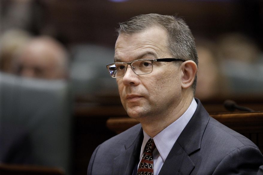 FILE - In this Feb. 1, 2012 file photo, Illinois State Education Superintendent Christopher Koch is seen at the state Capitol in Springfield, Ill. An Illinois State Board of Education report released Wednesday, March 12, 2014, shows more school districts' are in poor financial shape. The annual profile places school districts into four categories ranging from high financial strength to high risk. Koch says the profiles show the effects of budget cuts on education in recent years. (AP Photo/Seth Perlman, File)