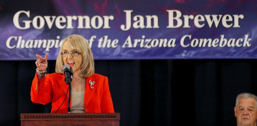 Arizona Gov. Jan Brewer announces that she will not seek a third term and will retire at the end of her current term, Wednesday, March 12, 2014, in Glendale, Ariz. (AP Photo/Matt York)