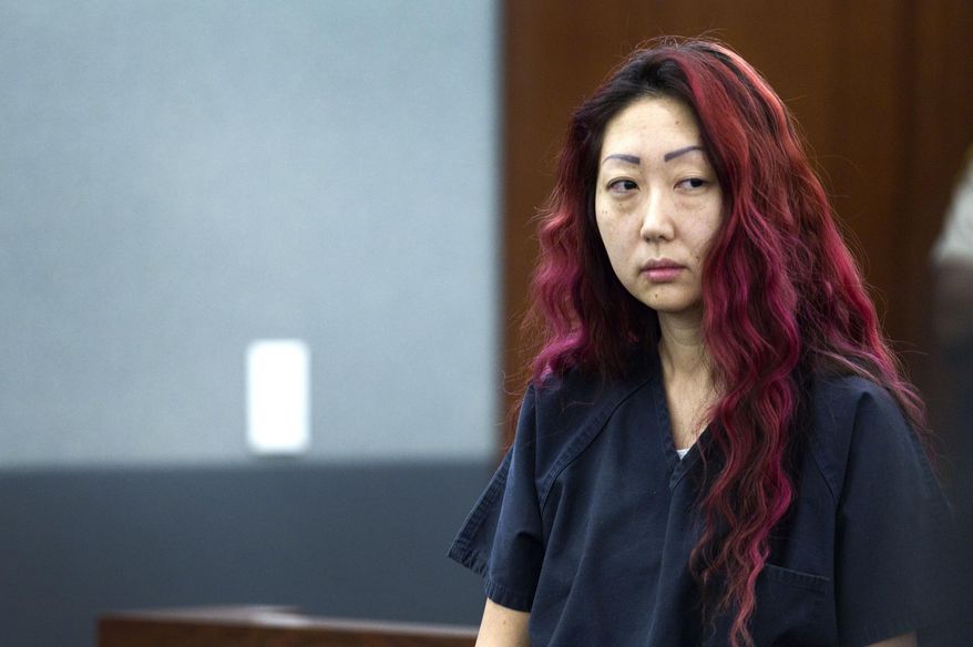 Pet shop owner Gloria Lee appears in court at the Regional Justice Center in Las Vegas, Wednesday, March 12, 2014. Lee and co-defendant Kirk Bills pleaded not guilty to charges of torching the pet shop where 27 puppies were rescued, and a judge rejected a bid for lower bail. (AP Photo/Las Vegas Sun, Steve Marcus)