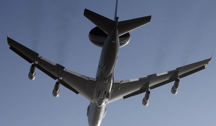 A Nato AWACS plane takes off the NATO Airbase in Geilenkirchen, Germany, Wednesday, March 12, 2014. AWACS planes flying out of Geilenkirchen to patrol over Romania and Poland. (AP Photo/Frank Augstein)