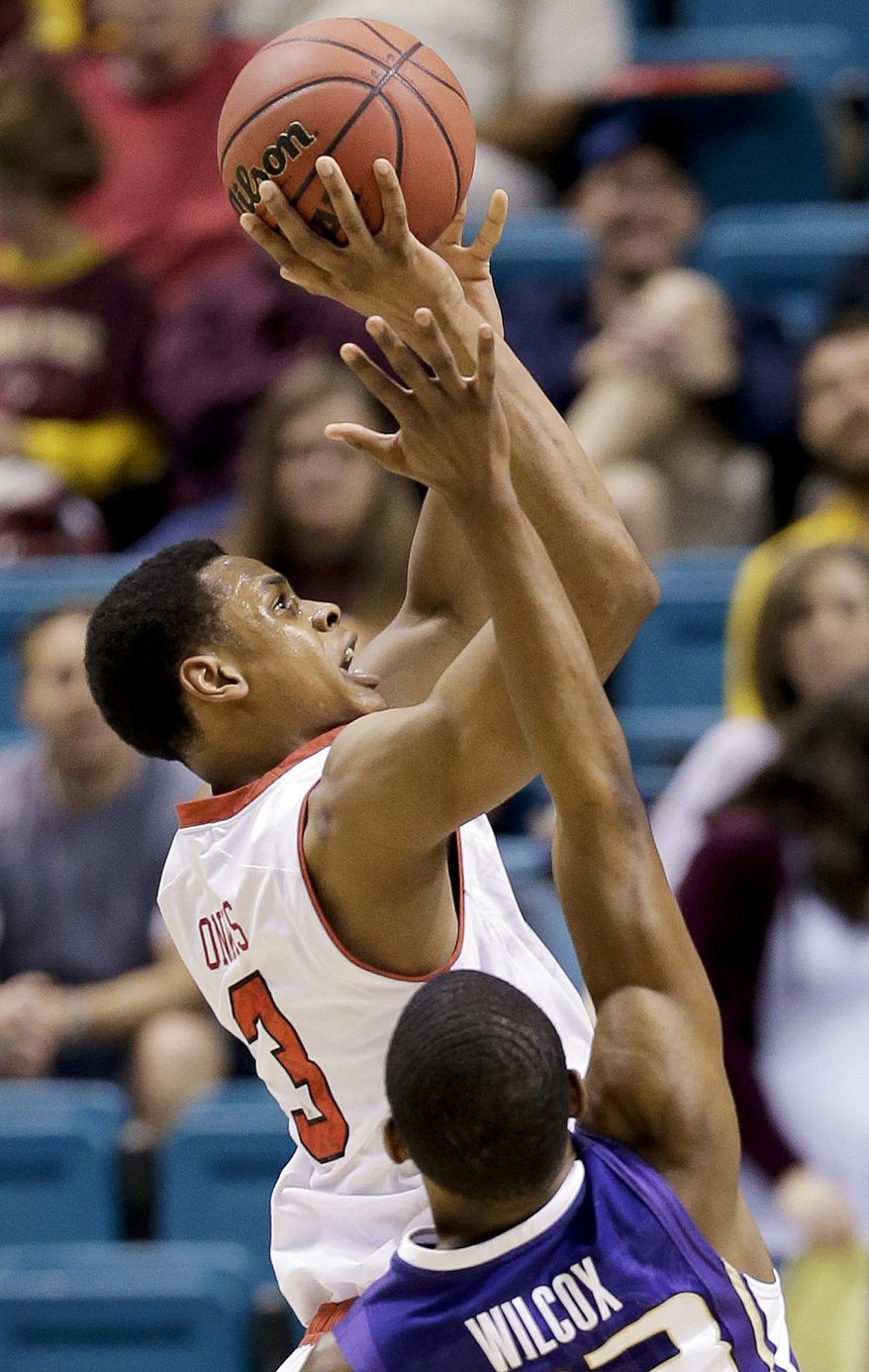 Utah's Princeton Onwas shoots against Washington's C.J. Wilcox in the first half of an NCAA Pac 12 conference tournament college basketball game, Wednesday, March 12, 2014, in Las Vegas. (AP Photo/Julie Jacobson)