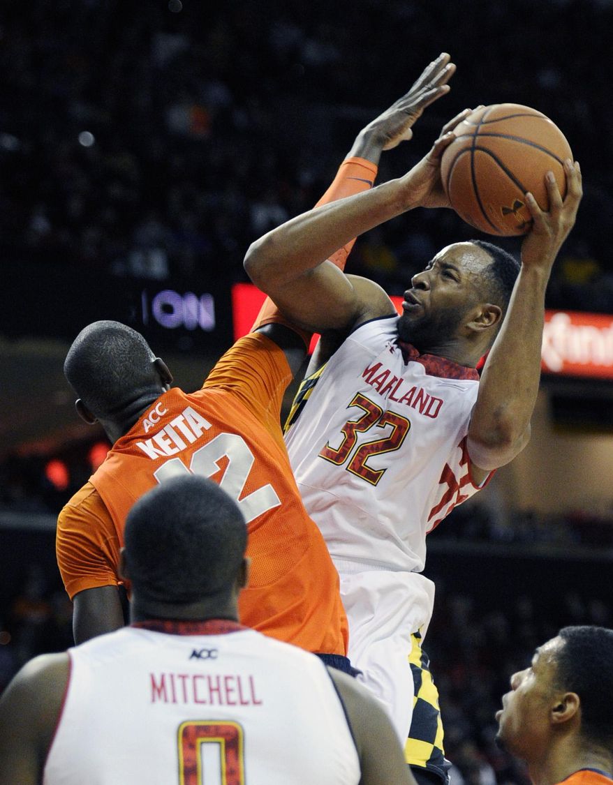 FILE - This Monday, Feb. 24, 2014 file photo shows Maryland's Dez Wells (32) fouled by Syracuse center Baye-Moussa Keita (12) during the second half of an NCAA college basketball game in College Park, Md. A judge has allowed most of the claims in a federal lawsuit filed by Wells, a former Xavier University basketball player against the school and its president to proceed to trial. Wells' lawsuit, filed in August, included 11 claims against the university and its president, Father Michael Graham, including sex discrimination, intentional infliction of emotional distress, libel for injury to his reputation and negligence. (AP Photo/Nick Wass, File)