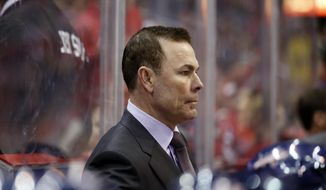 FILE - This Feb. 6, 2014 file photo shows Washington Capitals head coach Adam Oates on the bench in the third period of an NHL hockey game against the Winnipeg Jets, in Washington. Alex Ovechkin and the Washington Capitals are fading. Ovechkin has gone without a point in the last four games, and his team has lost five of its past six to drop to 10th in the Eastern Conference. (AP Photo/Alex Brandon, File)