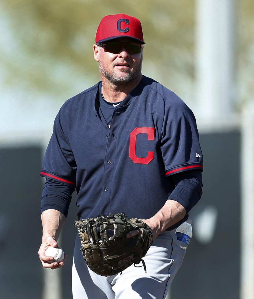 FILE - In this Feb. 17, 2014, file photo, Cleveland Indians' Jason Giambi plays first base during a spring training baseball practice in Goodyear, Ariz. Giambi will be sidelined for about three-to-four weeks with a broken rib in his right side after being hit by a pitch thrown from Edwin Jackson of the Chicago Cubs in the third inning of a March 7 game. (AP Photo/Paul Sancya, File)