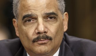 ** FILE ** This Jan. 29, 2014, file photo shows Attorney General Eric Holder on Capitol Hill in Washington. (AP Photo/J. Scott Applewhite, File)