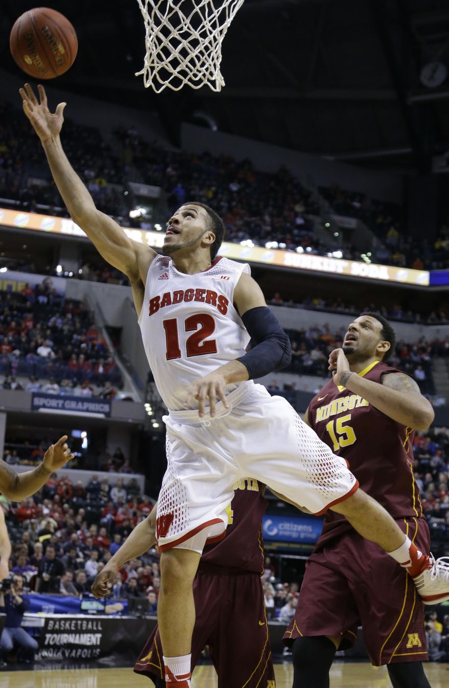 Wisconsin guard Traevon Jackson (12) goes up for a basket in the first half of an NCAA college basketball game against Minnesota in the quarterfinals of the Big Ten Conference tournament Friday, March 14, 2014, in Indianapolis. (AP Photo/Michael Conroy)