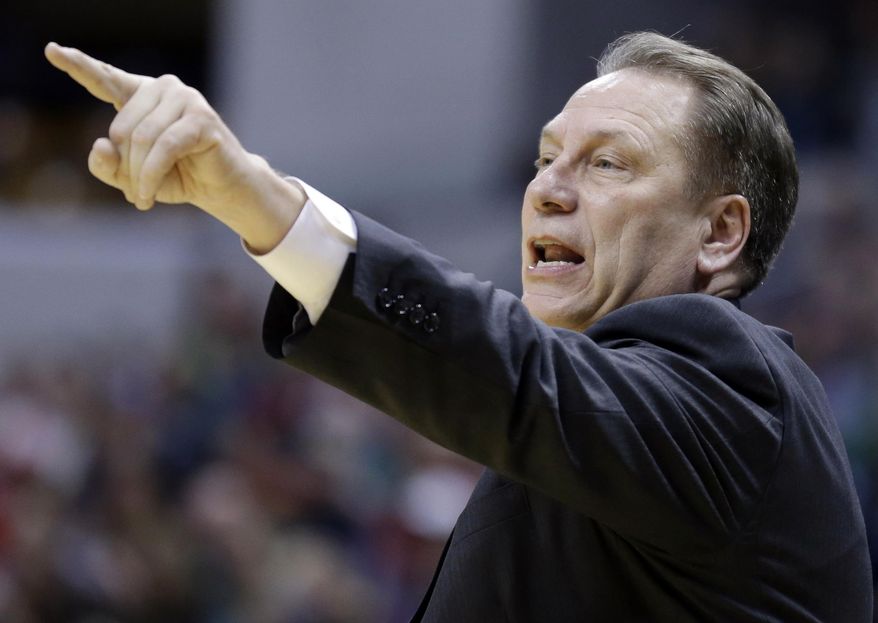 Michigan State head coach Tom Izzo directs his team in the second half of an NCAA college basketball game against Northwestern in the quarterfinals of the Big Ten Conference tournament Friday, March 14, 2014, in Indianapolis. (AP Photo/Michael Conroy)