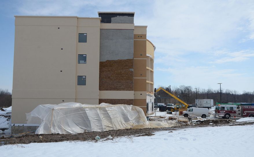 The scene where a scaffolding collapsed Friday, March 14, 2014 at a hotel construction site in Emmett Township, Mich. . The scaffold collapse, at a hotel construction site, injured six workers. (AP Photo/The Enquirer,John Grap) NO SALES