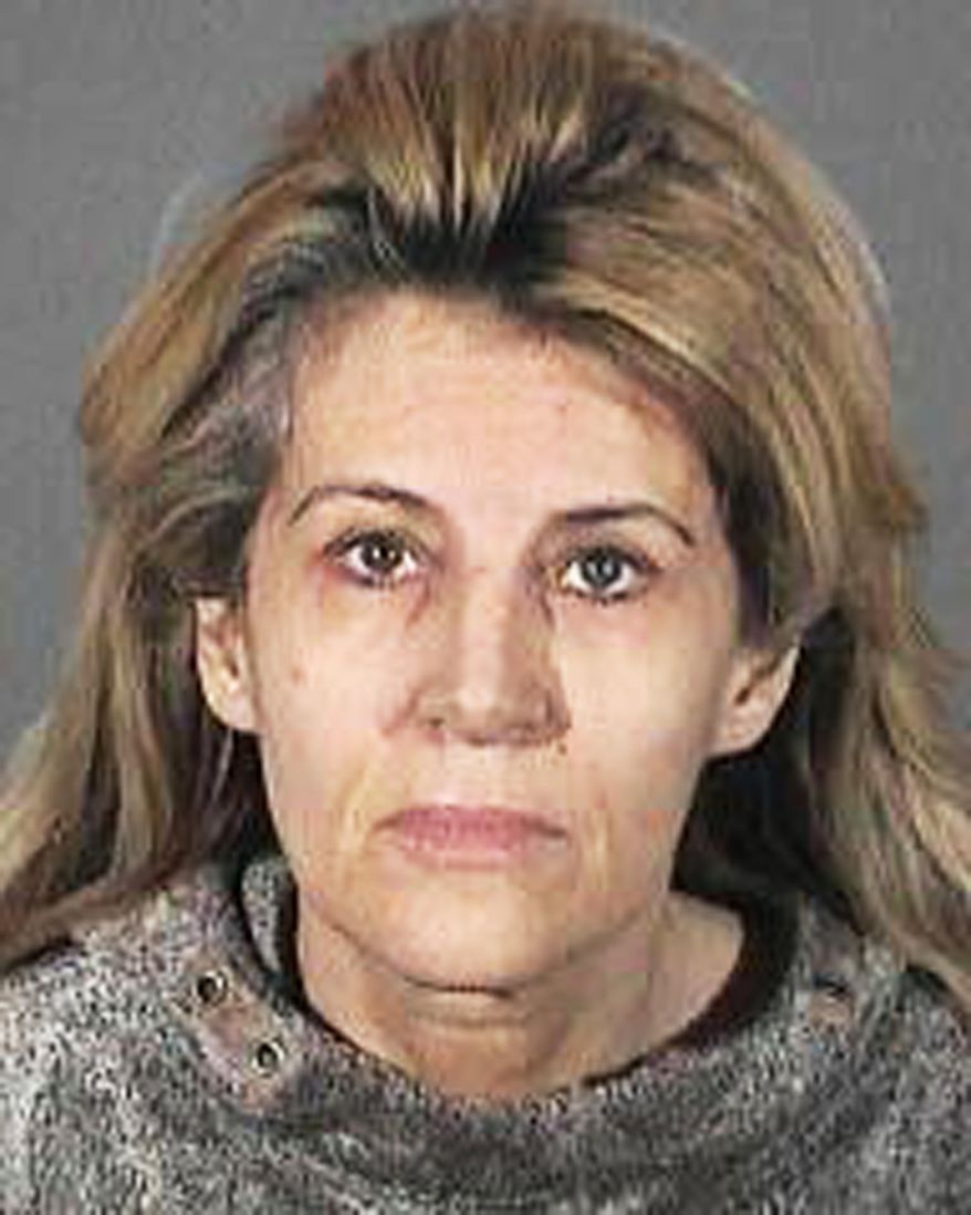 This undated handout booking photo from the Los Angeles County Sheriff shows Dawn DaLuise. DaLuise, 55, was arrested after authorities say she tried to hire someone to kill a business rival she mistakenly thought was behind a cyber-stalking campaign, which included lewd flyers, emails and Craigslist ads with her address seeking men to act out a "rape fantasy." Authorities recently arrested a suspect in the case, which was not the man she sought to have killed. (AP Photo/Los Angeles County Sheriff)