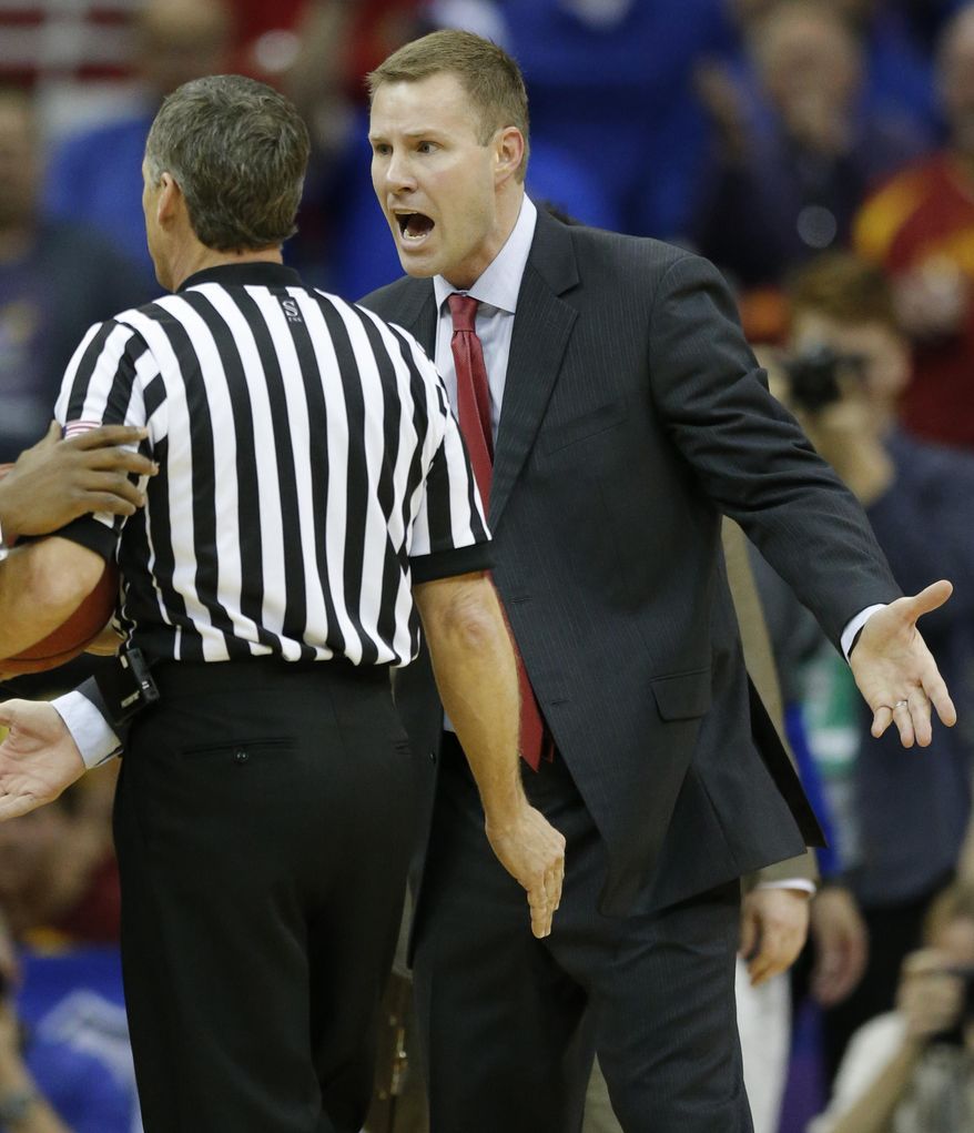 Iowa State head coach Fred Hoiberg, right, pleads his case after being called for a technical foul during the first half of an NCAA college basketball game against Kansas in the semifinals of the Big 12 Conference men's tournament in Kansas City, Mo., Friday, March 14, 2014. (AP Photo/Orlin Wagner)