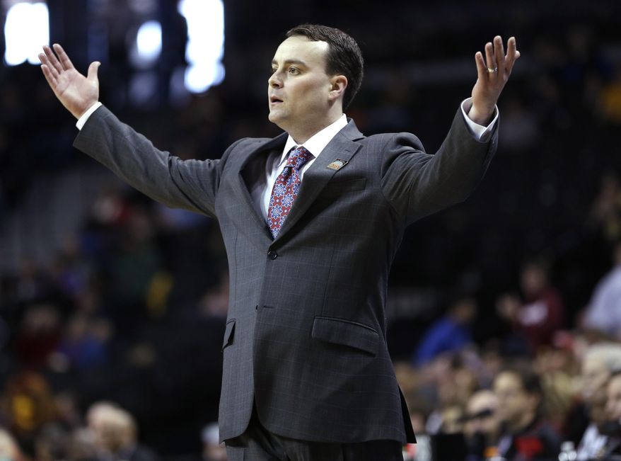 Dayton head coach Archie Miller gestures during the first half of an NCAA college basketball game against Saint Joseph&#39;s in the quarterfinal round of the Atlantic 10 Conference tournament at the Barclays Center in New York, Friday, March 14, 2014. (AP Photo/Seth Wenig)