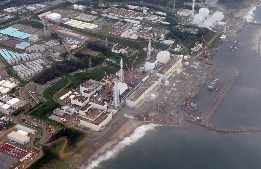 **FILE** The Fukushima Dai-Ichi nuclear plant at Okuma in Fukushima prefecture, northern Japan, is seen here on Aug. 20, 2013. Scientists have crowd-sourced a volunteer network to monitor radiation moving across the Pacific Ocean since the 2011 earthquake and tsunami damaged the plant. (AP Photo/Kyodo News)