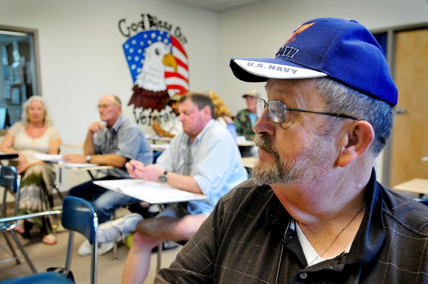US Navy vet Glenn Pelham takes a Peer Specialist Training class at the Volunteers of America Veterans Service Center in Cocoa, Fla. on March 4, 2014. Volunteers of America multi-service center that offers programs to residents and others at Veterans Village, a transitional home for veterans. Residents can stay at the transitional home until they are ready to regain their independence or for up to two years. (AP Photo/Florida Today, Craig Rubadoux) NO SALES
