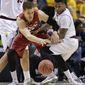 Stanford&#39;s Dwight Powell, left, and Arizona State&#39;s Jahii Carson vie for a loose ball in the first half of an NCAA college basketball game in the Pac-12 men&#39;s tournament quarterfinals, Thursday, March 13, 2014, in Las Vegas. (AP Photo/Julie Jacobson)
