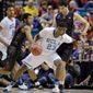 UCLA&#39;s Tony Parker drives against Stanford&#39;s Stefan Nastic in the first half during an NCAA college basketball game in the semifinals of the Pac-12 men&#39;s tournament, Friday, March 14, 2014, in Las Vegas. (AP Photo/Julie Jacobson)
