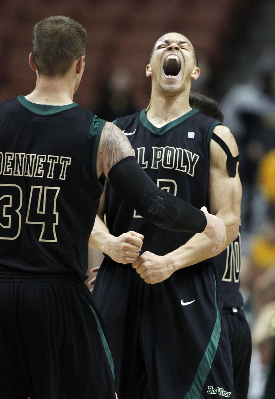 Cal Poly forward Chris Eversley, right, celebrates with forward Brian Bennett (34) after a basket against UC Irvine in the second half of an NCAA college basketball game of the Big West Conference men's tournament in Anaheim, Calif., Friday, March 14, 2014. Cal Poly won 61-58. (AP Photo/Alex Gallardo)