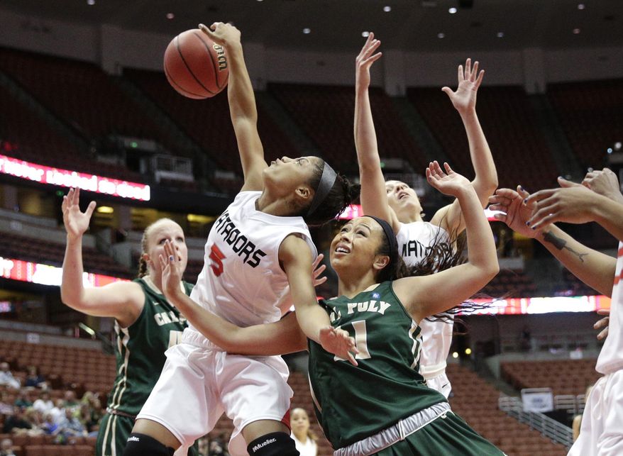 Cal State Northridge's Ashlee Guay (5) and Cal Poly's Kristen Ale (11) fight for a rebound during the first half of an NCAA college basketball game in the final of the Big West Conference tournament, on Saturday, March 15, 2014, in Anaheim, Calif. (AP Photo/Jae C. Hong)
