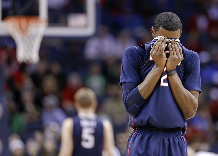 Connecticut forward DeAndre Daniels (2) wipes his face during the second half of an NCAA college basketball game against Louisville in the final of the American Athletic Conference men's tournament Saturday, March 15, 2014, in Memphis, Tenn. Louisville won 71-61. (AP Photo/Mark Humphrey)