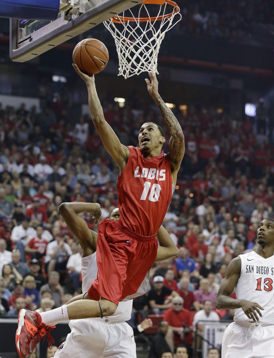 New Mexico's Kendall Williams shoots over San Diego State's Winston Shepard (10) during the first half of an NCAA college basketball game for the Mountain West Conference tournament championship on Saturday, March 15, 2014, in Las Vegas. (AP Photo/Isaac Brekken)