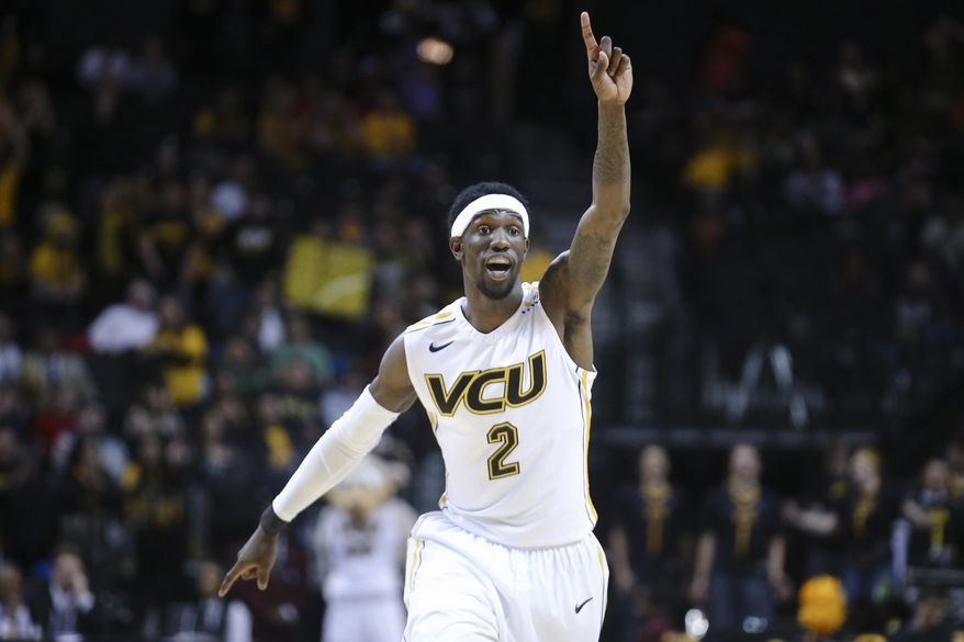 VCU guard Briante Weber (2) reacts during the first half of an NCAA college basketball game against Richmond in the quarterfinal round of the Atlantic 10 Conference tournament at the Barclays Center in New York, Friday, March 14, 2014. VCU defeated Richmond, 71-53. (AP Photo/John Minchillo)