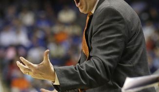 Clemson head coach Brad Brownell reacts to a call during the second half of a quarterfinal NCAA college basketball game against Duke at the Atlantic Coast Conference tournament in Greensboro, N.C., Friday, March 14, 2014. (AP Photo/Gerry Broome)
